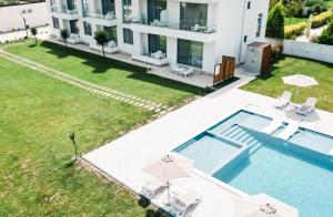 an aerial view of a house with a swimming pool at Apartments Antique in Ulcinj