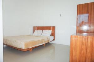 Кровать или кровати в номере Sakura Kos RedPartner