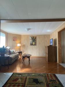 a living room with a couch and a table at Home in Brazil in Brazil