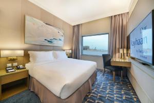 Postel nebo postele na pokoji v ubytování Dar Rayhaan by Rotana Al Khobar