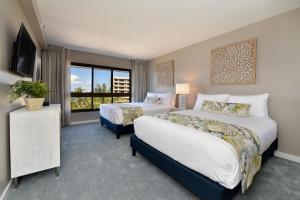 a hotel room with two beds and a window at Kaanapali Alii 385 in Kaanapali