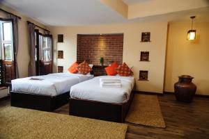 Letto o letti in una camera di Thagu Chhen, a Boutique Hotel
