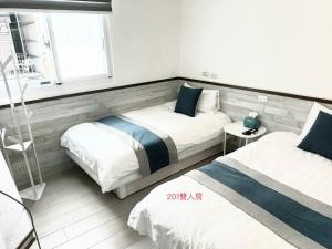 Ένα ή περισσότερα κρεβάτια σε δωμάτιο στο Xiaomi Courtyard B&B