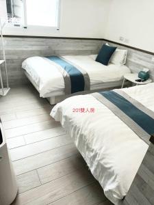 Ένα ή περισσότερα κρεβάτια σε δωμάτιο στο Xiaomi Courtyard B&B