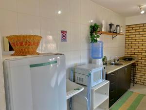 Η κουζίνα ή μικρή κουζίνα στο Apartamento Floripa 17 Aconchegante Bem Localizado