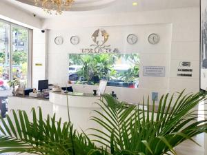 a waiting room with clocks on the wall at Issara Patong Beach in Patong Beach +81 photos