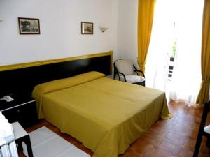 Postel nebo postele na pokoji v ubytování Hotel La Playa