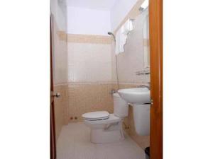 a bathroom with a toilet and a sink at Saigon Cozy2 Hotel in Ho Chi Minh City