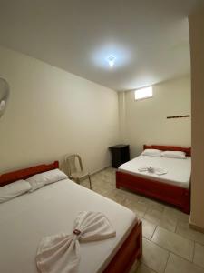 En eller flere senge i et værelse på Capi Monzerra