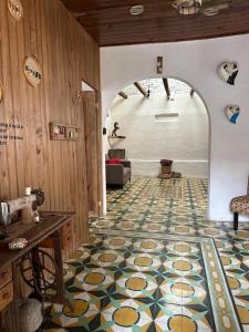 a room with a floor with a patterned floor at Chunca Casa-Hostal boutique in San Cristóbal de Las Casas