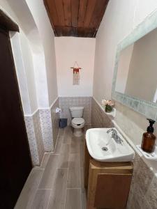 a bathroom with a sink and a toilet at Chunca Casa-Hostal boutique in San Cristóbal de Las Casas