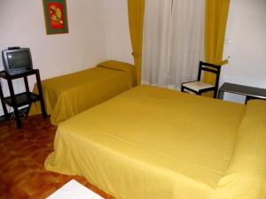 Postel nebo postele na pokoji v ubytování Hotel La Playa