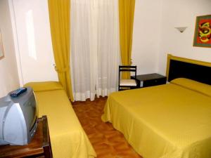 Postel nebo postele na pokoji v ubytování Hotel La Playa