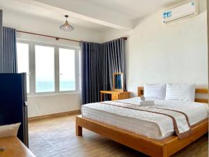 Una cama o camas en una habitación de Sun Rose Hotel & Apartment