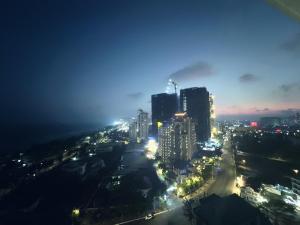 a view of a city at night at CSJ Dy House in Vung Tau