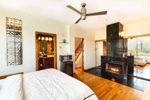 a bedroom with a bed and a fireplace at *RARE* Heated Pool *FREE* Parking w/ City Views in Philadelphia