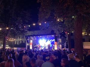 a crowd of people watching a concert at night at Summit happiness at the purple beech in Bad Harzburg