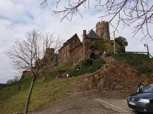 a castle sitting on top of a hill at Rednak Modern Retreat in Polch