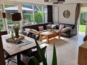 a living room with a couch and a table at Vision Comfortable holiday residence in Sint Maarten