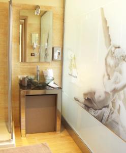 a bathroom with a sink and a mirror at Ming Hao Hotel in Milan