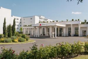 a view of the front of a building at Paris Marriott Charles de Gaulle Airport Hotel in Roissy-en-France