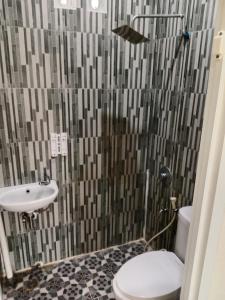 Un baño de Macan Kumbang Residence