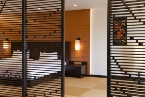 a room with a wall of wine racks at Grand Mercure Okinawa Cape Zanpa Resort in Yomitan