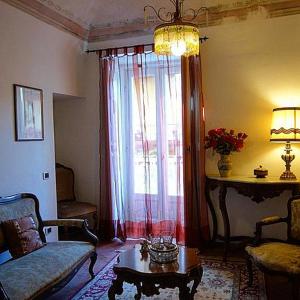 a living room with a couch and a table and a window at Antica Dimora Fuori Le Mura B&B in Scanno