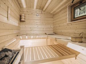 a wooden sauna with a tub and a sink at Mountain hut Hochpillberg Tyrol in Pill
