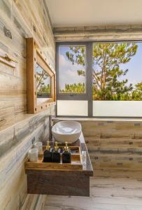 a bathroom with a sink and a window at Love Hill Resort in Da Lat