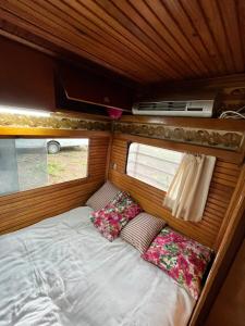 a small bed in the back of an rv at Caravan camp in Erdemli