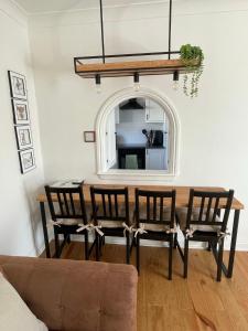 a dining room with a table and chairs at Daisy Cottagee in Alyth
