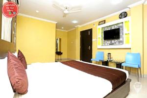 Voodi või voodid majutusasutuse Hotel Sai Sandpiper Puri Near Sea Beach toas