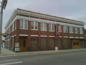 a large brick building on the corner of a street at Historic Hotel Greybull in Greybull