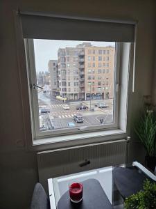 a window with a view of a city street at skyline flat with free parking in Lorenskog