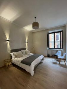 Ένα ή περισσότερα κρεβάτια σε δωμάτιο στο Ten Miles Guesthouse Roma