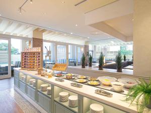 a restaurant with a buffet of food on display at Oriental Hotel Tokyo Bay in Urayasu +108 photos