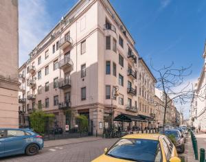 a yellow car parked in front of a building at Raday Bobo in Budapest