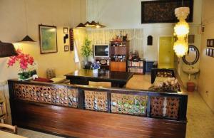 a living room with a couch and a table at TRAVELLERS LODGE in Malacca