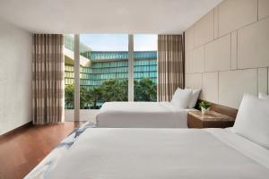Postel nebo postele na pokoji v ubytování JW Marriott Hotel Hanoi