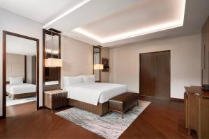 Postel nebo postele na pokoji v ubytování JW Marriott Hotel Hanoi