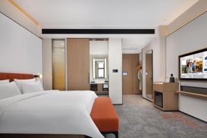 Postelja oz. postelje v sobi nastanitve Hampton by Hilton Dongguan Liaobu Songshan Lake Avenue
