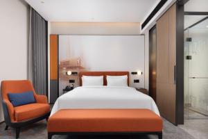 Postelja oz. postelje v sobi nastanitve Hampton by Hilton Dongguan Liaobu Songshan Lake Avenue