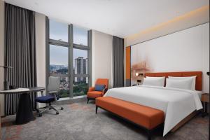 Postel nebo postele na pokoji v ubytování Hampton by Hilton Dongguan Liaobu Songshan Lake Avenue
