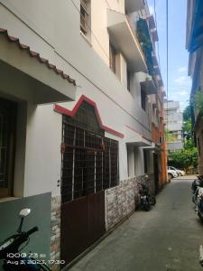 a gate on the side of a building at Nest Inn in Pondicherry