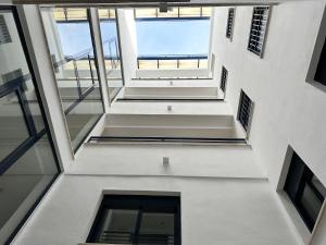 a view from the top of a building with windows at Apartamento Trópico in La Herradura