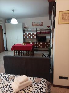 a living room with a couch and a table at Casa Angela Parma in Parma