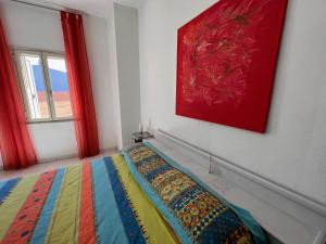 A bed or beds in a room at Casa Viola di Maria Gabriella, San Vito a 25 minuti da Costa Rey e Villasimius