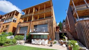 an apartment building with a patio in front of it at Apartement Dukanovic in Sankt Anton am Arlberg