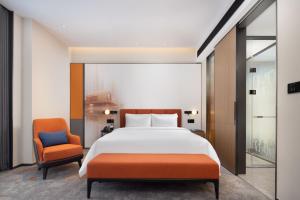 Postelja oz. postelje v sobi nastanitve Hampton by Hilton Dongguan Liaobu Songshan Lake Avenue
